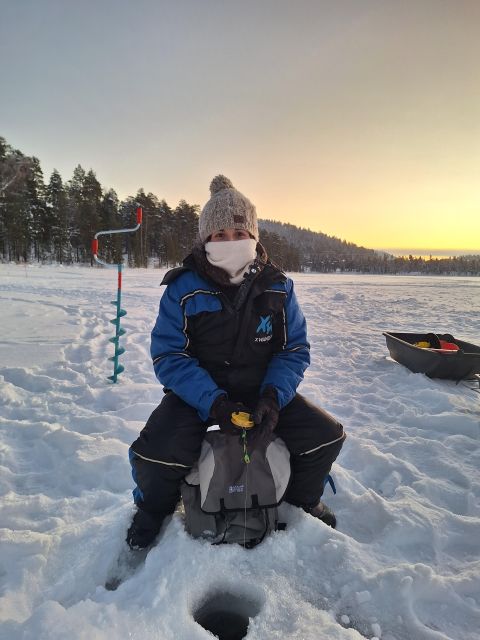Arctic Fishing & Open Fire Cooking - Drilling through the ice by hand