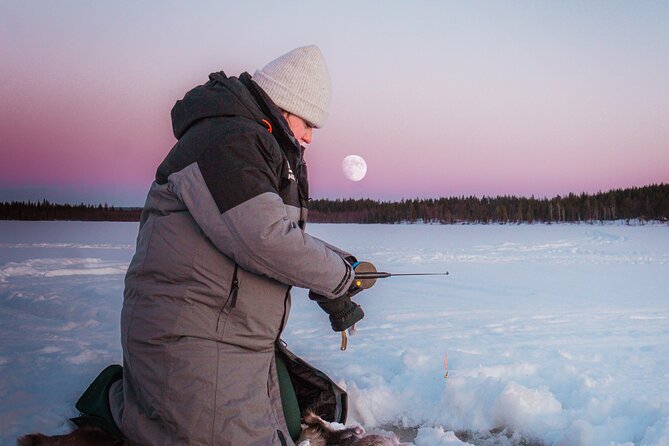 Authentic Reindeer Experience and Ice Fish with Lunch in the Wild - Ice fishing on a frozen lake