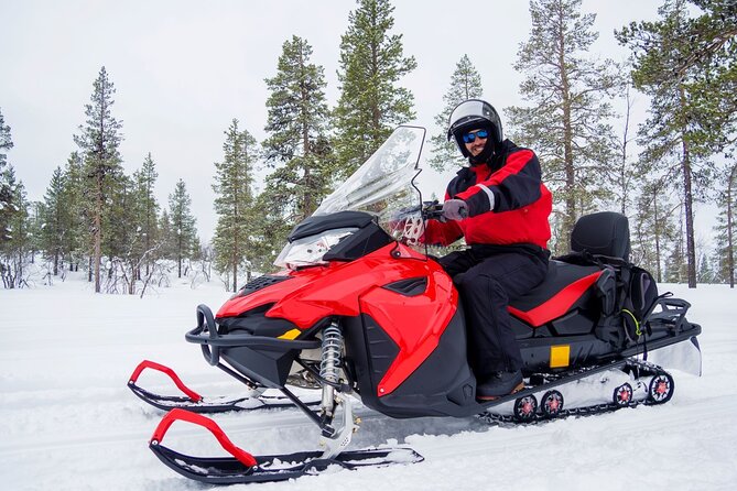 Easy Snowmobile Safari - Riding from frozen river to Finnish forest