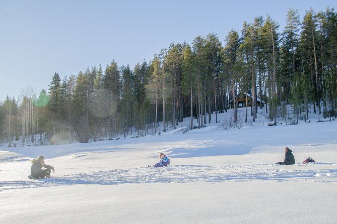 First Ice Fishing Experience in Rovaniemi - Finnish snacks and hot drinks by the open fire