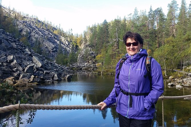 Guided easy hike in Finland deepest gorge in Pyhä-Luosto National Park - Walking toward Holy Baptism Waterfall