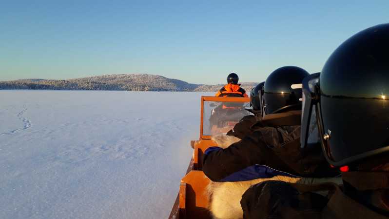 Ivalo: Ice Fishing Tour to Lake Inari, Reindeers & Lunch - Learning to fish through the ice