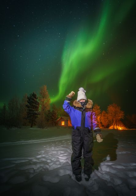 Ivalo: Lake Inari Northern Lights Tour w/ Reindeer & Dinner - Riding a covered sleigh across frozen Lake Inari
