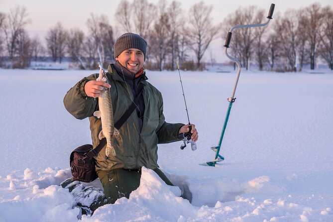 Lapland Ice Fishing Experience from Rovaniemi - Drilling your first hole in the ice