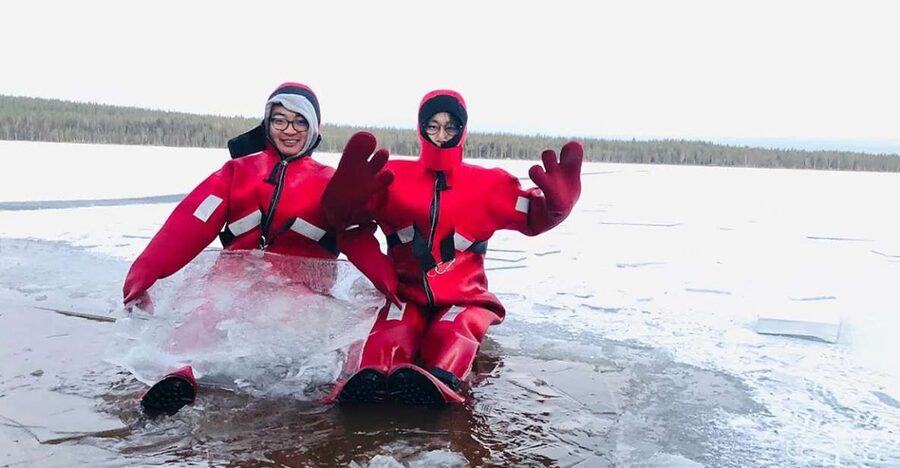 Lapland: Ice Fishing, Floating & BBQ Snow Adventure - A frozen lake, a fishing hole, and a very strange swim