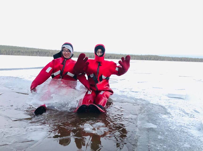 Lapland: Ice Fishing, Floating & BBQ Snow Adventure - Ice floating in a survival suit