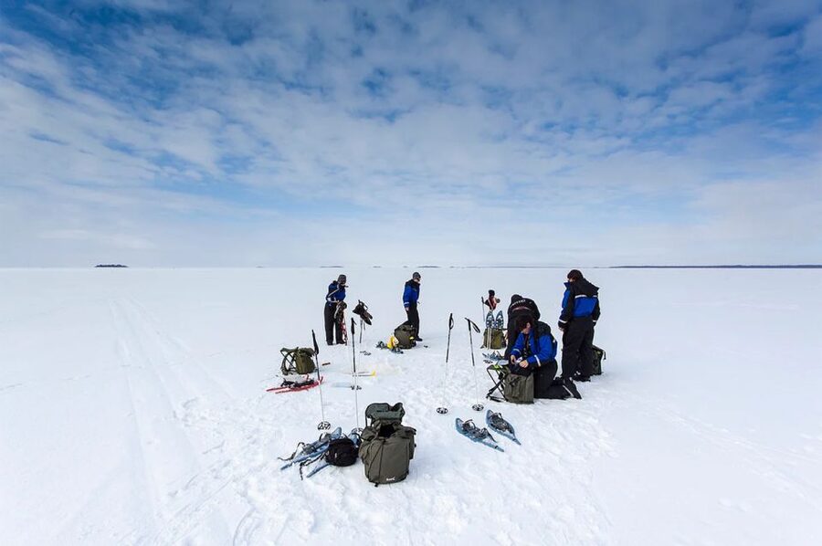 Lapland: Ice Fishing, Floating & BBQ Snow Adventure - The salmon barbecue warms up the middle of the day