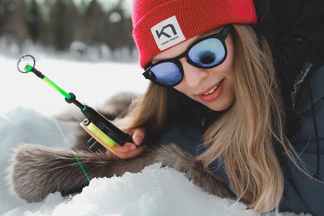 Lappish Lunch Break -Snowmobiling, ice fishing and tasty food - Cutting an ice hole and trying the Finnish way