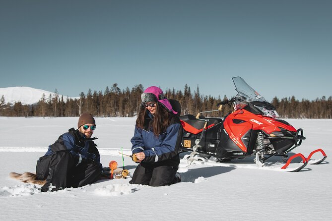 Lappish Lunch Break -Snowmobiling, ice fishing and tasty food - Sharing a snowmobile through the Finnish wilderness
