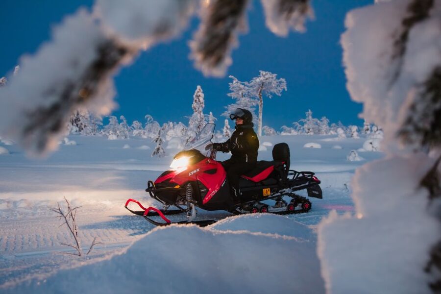 Levi: Evening Snowmobile Safari - Riding through the snowy forest