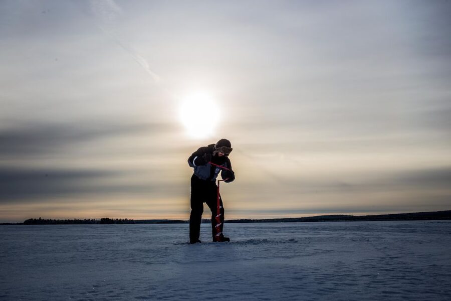 Levi: Ice Fishing on a Frozen Lake - The campfire break and cooking the catch