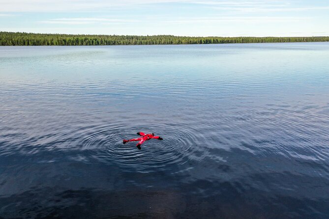 Midnight Sun Floating Experience in Forest Lake - Floating beneath a sun that refuses to set
