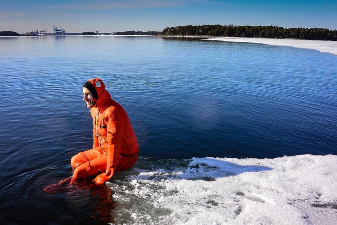 Redrib Ice Experience - Floating in icy water with a survival suit