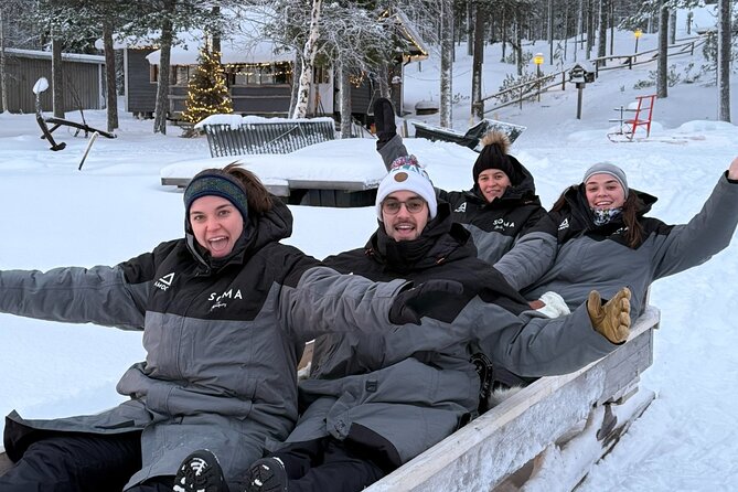 Reindeer Husbandry with Snowmobile Sleigh Ride and Cabin Lunch - Feeding reindeer and learning about husbandry