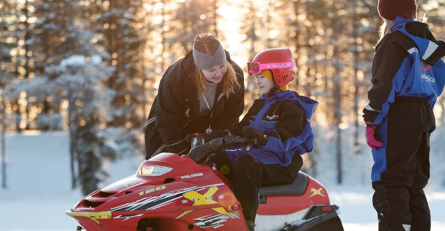 Rovaniemi: Family Snowmobile Trip with Guide and Picnic - The adult snowmobile ride through the forest