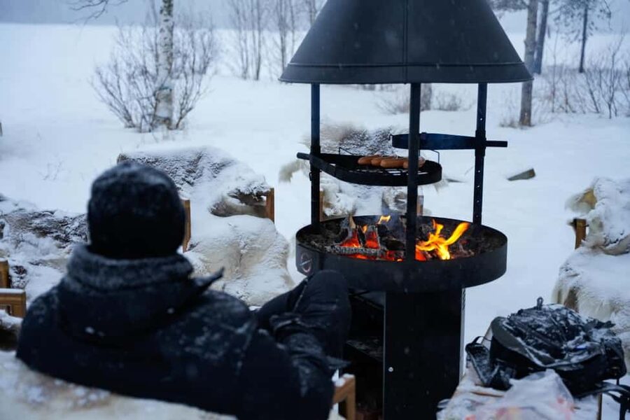 Rovaniemi: Ice Fishing Small Group Tour & Barbeque - Waiting for the catch