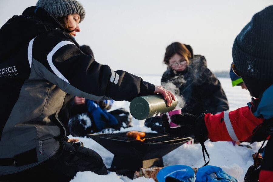 Rovaniemi: Ice Fishing & Snowmobile Safari Combo Day - Fire, sausages, and hot berry drinks