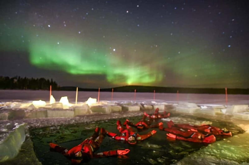 Rovaniemi: Ice Floating in Forest Lake with Aurora Borealis - Floating under the Rovaniemi night sky
