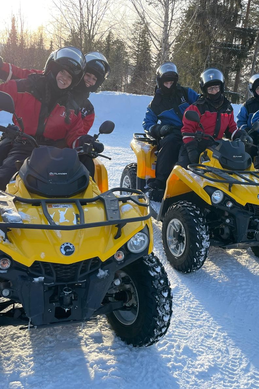 Rovaniemi: Quad Bike Ride and Ice Fishing - Drilling a hole in the frozen lake