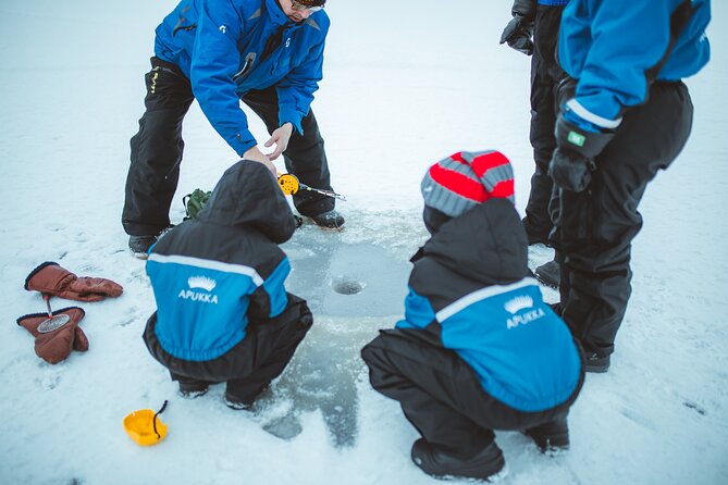 Snowmobiling and ice fishing in Apukka Resort, Rovaniemi - The bonfire stop adds needed warmth