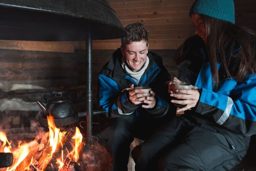 Ylläs: Snowmobile Adventure with Ice Fishing - Learning ice fishing on a frozen lake